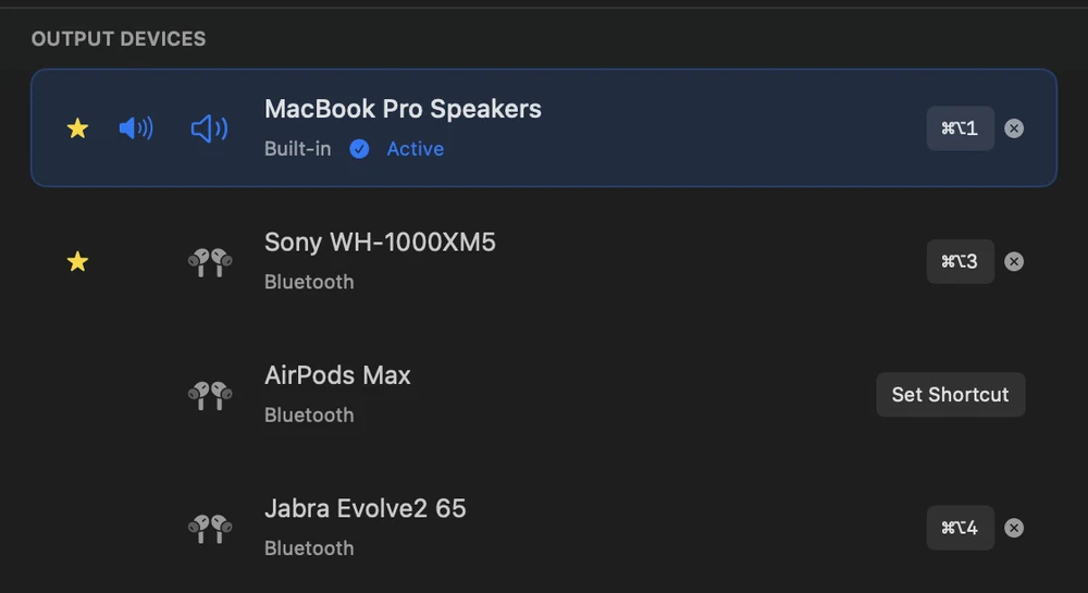 The output device list with keyboard shortcut chips highlighted beside three devices.